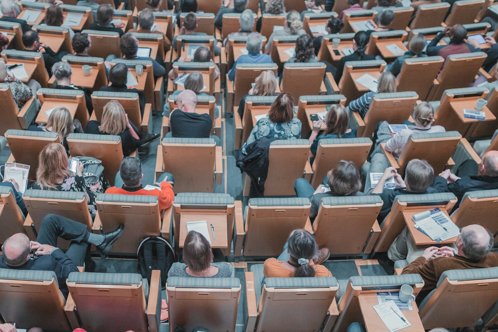 Photo by Mikael Kristenson high-angle photography of group of people sitting at chairs
