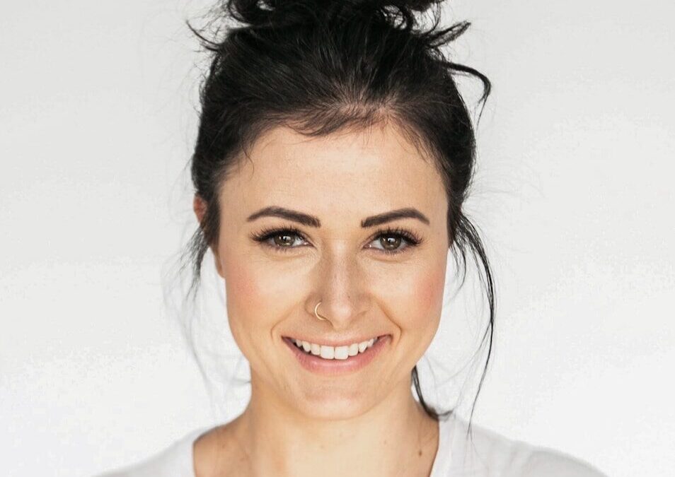 woman in white crew neck shirt smiling