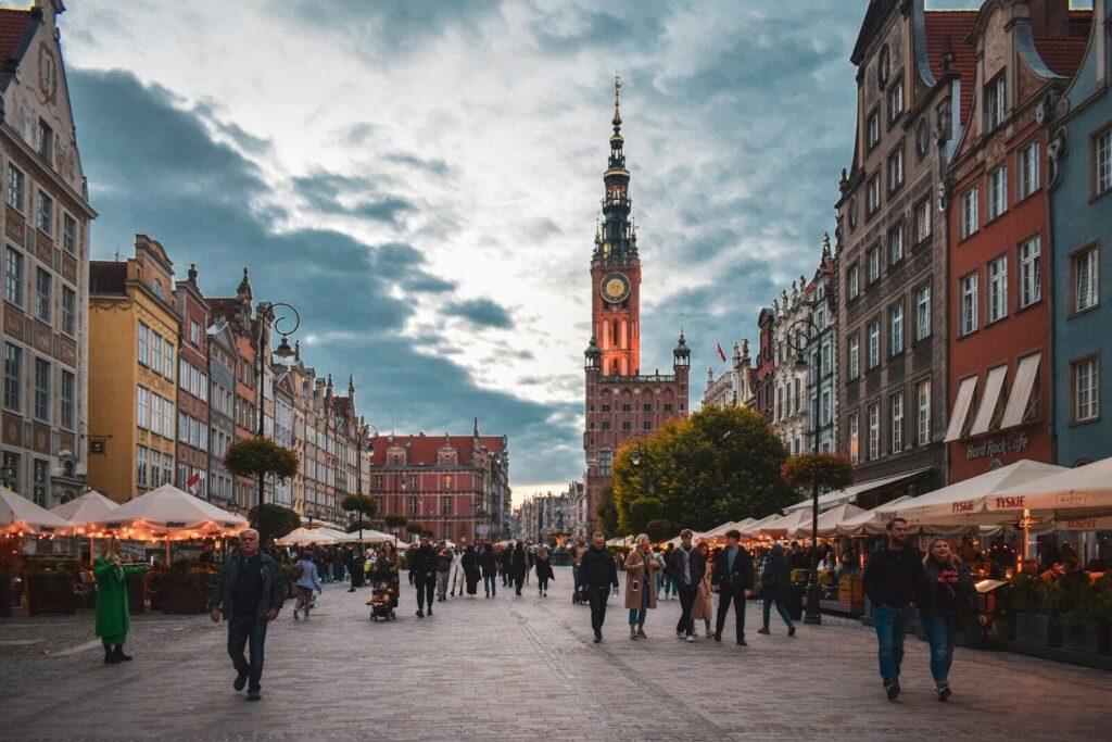 a group of people walking in a city